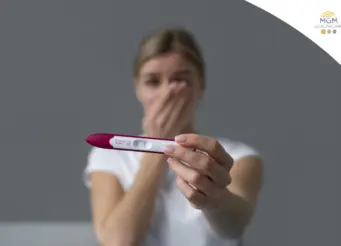 Pregnant woman noticing early first trimester symptoms including tiredness and nausea